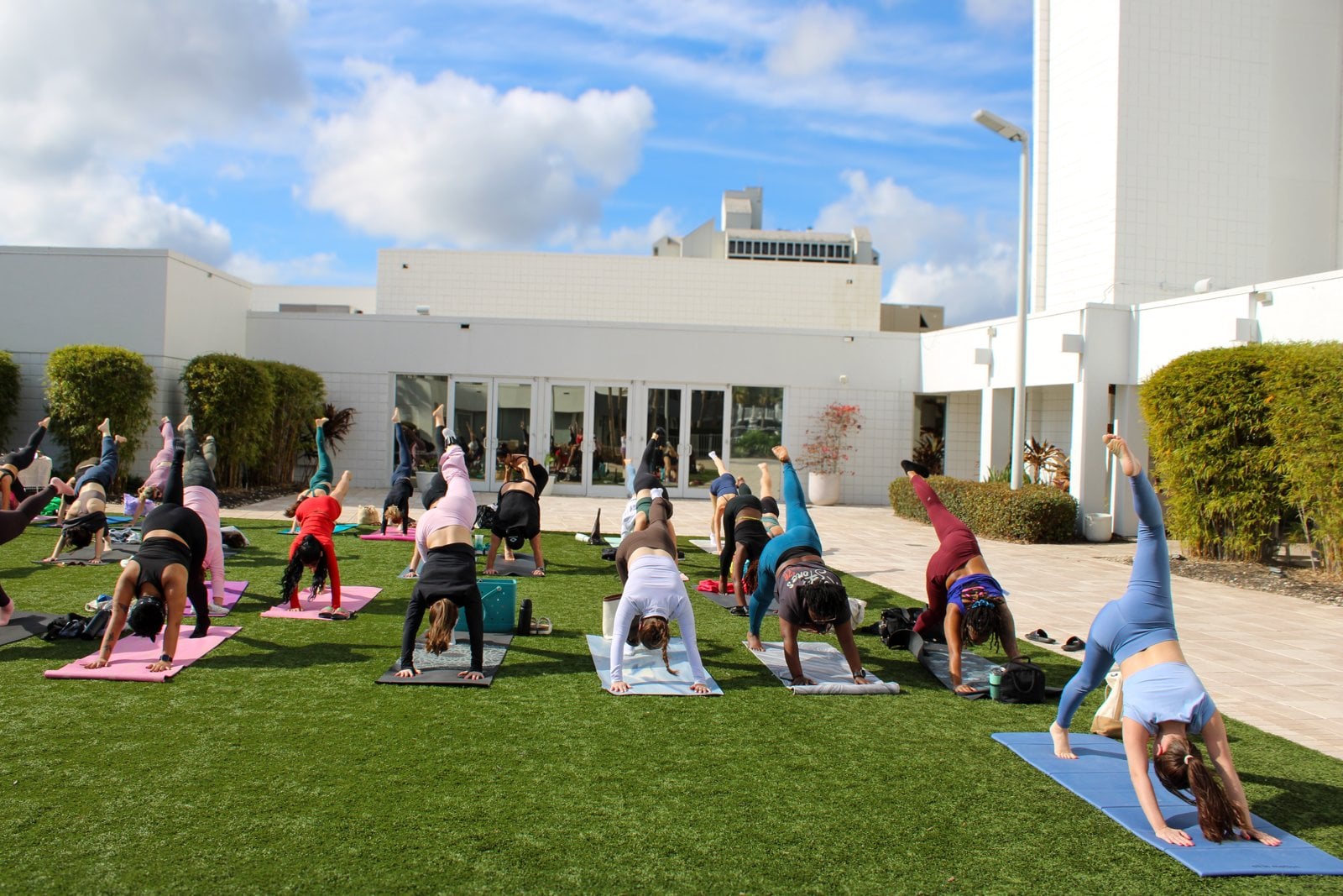 Yoga with Cariss class on the poolside lawn at Renaissance Orlando Resort